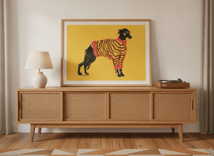 Modern wall art print standing on a sideboard in a mid-century home office