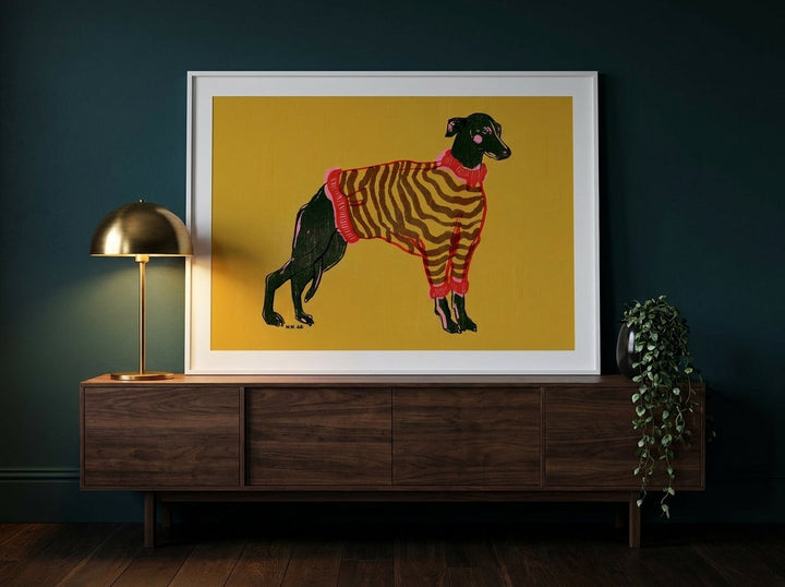 Modern wall art print standing on a sideboard in a moody living room