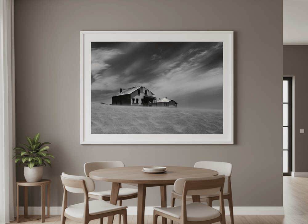 Wall art styled above a dining table in a contemporary home