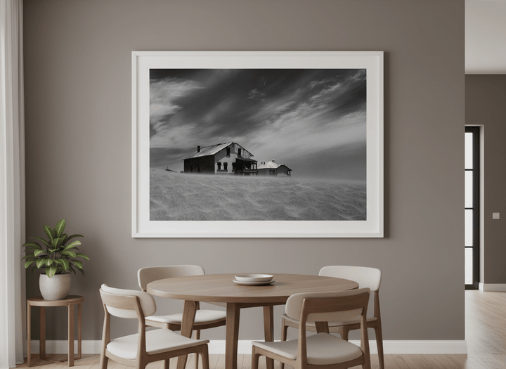 Wall art styled above a dining table in a contemporary home