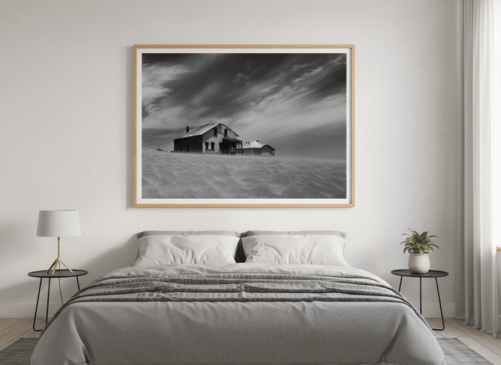Minimalist artwork displayed in a calm, light-filled bedroom interior