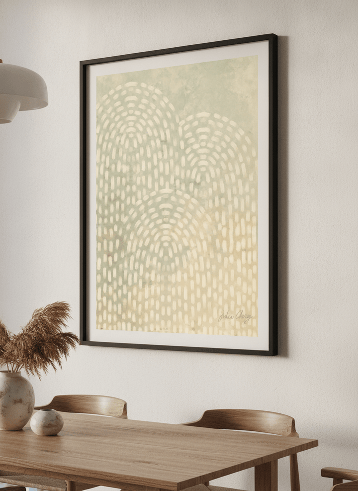 Wall art styled above a dining table in a contemporary home