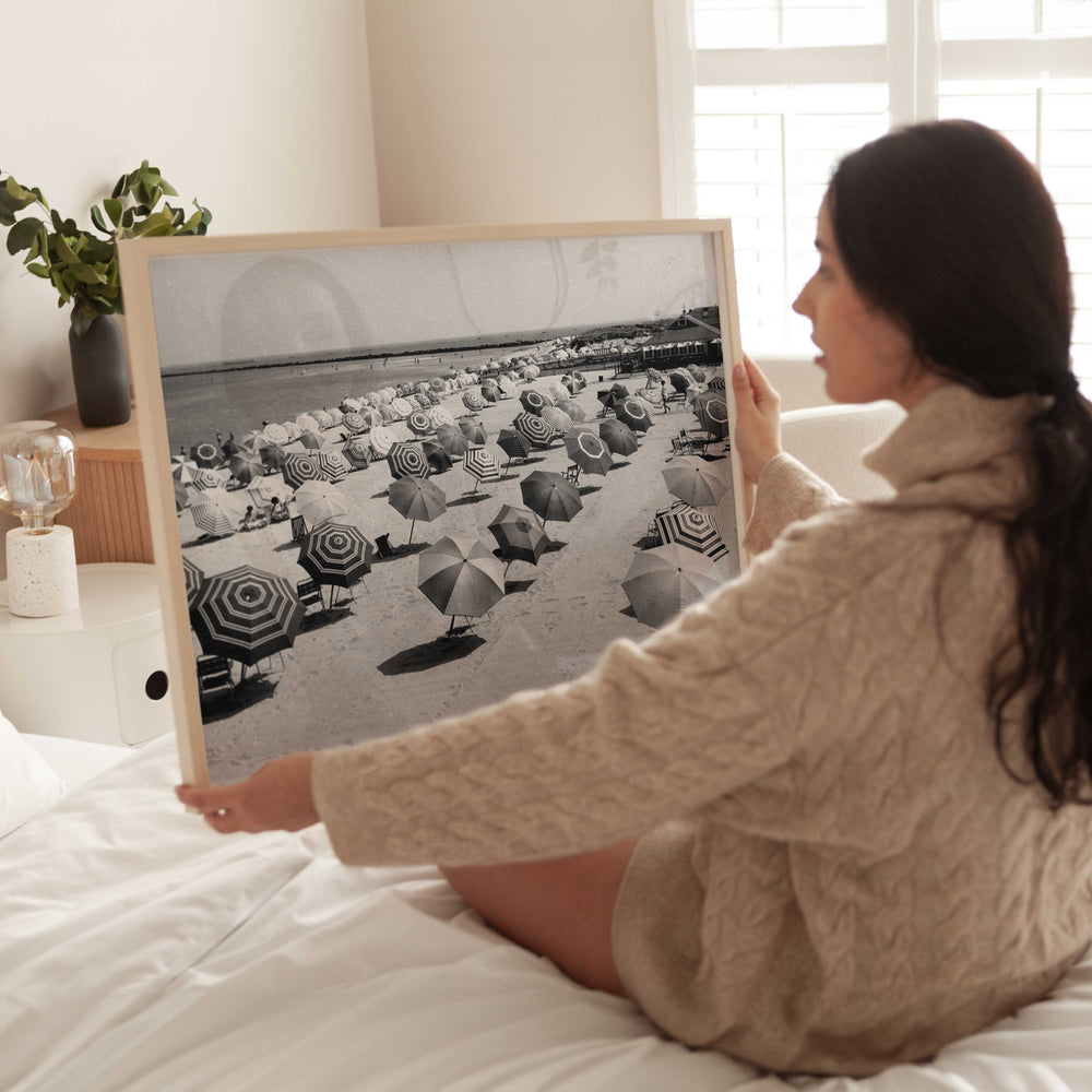 black and white umbrella coastal photography wall art girl holding timber