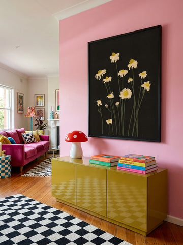 Oversized statement modern wall art print styled on the wall in a colourful eclectic living room