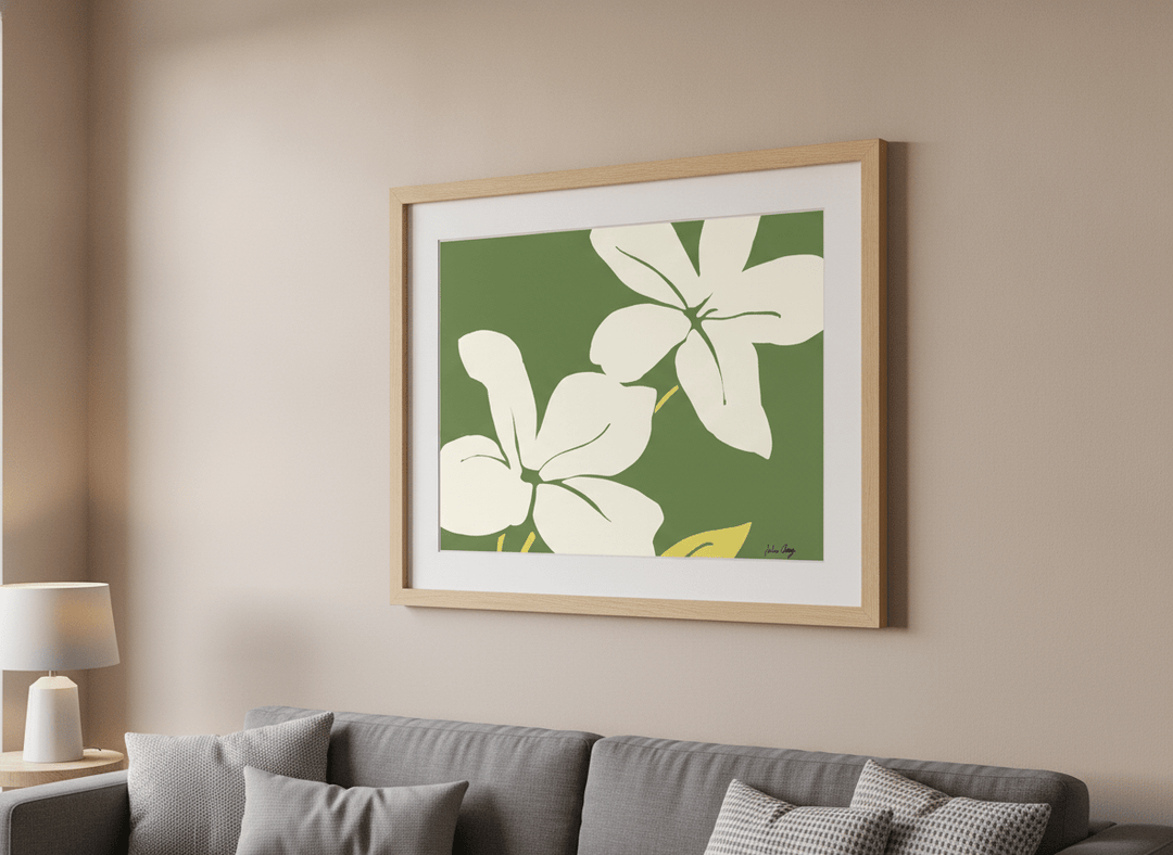 Modern wall art styled above a sofa in a neutral living room