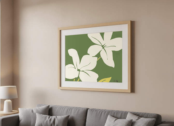 Modern wall art styled above a sofa in a neutral living room
