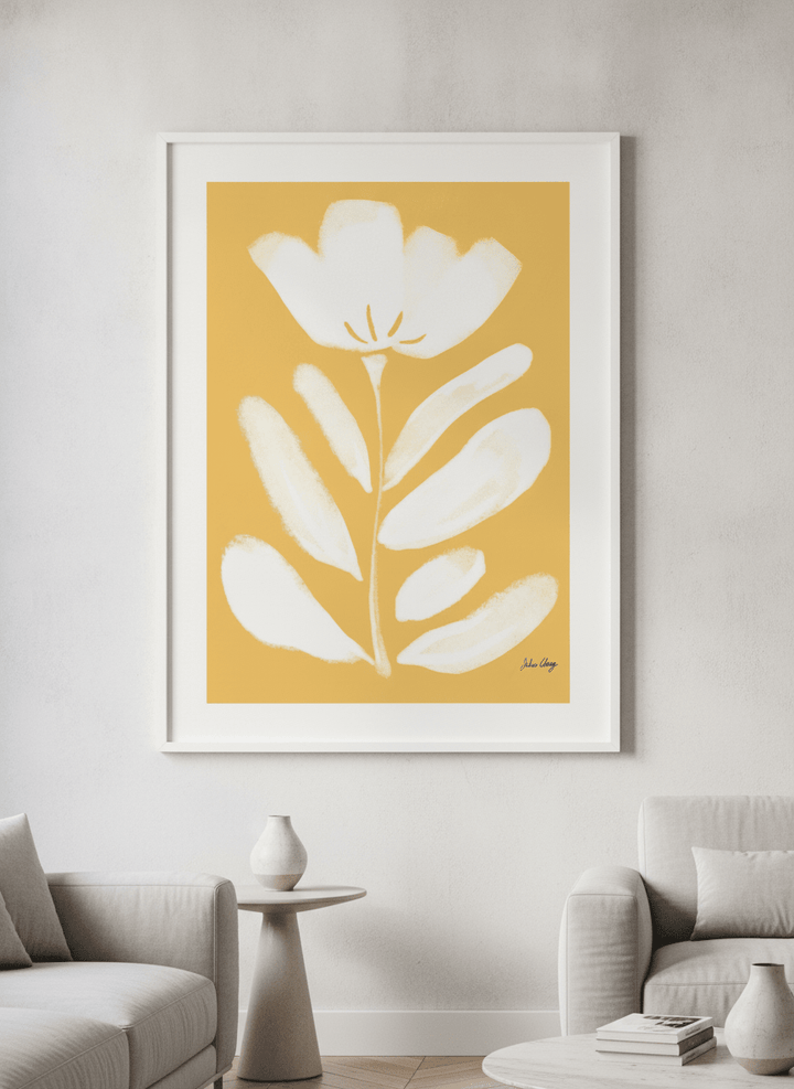 Modern wall art styled above a sofa in a neutral living room