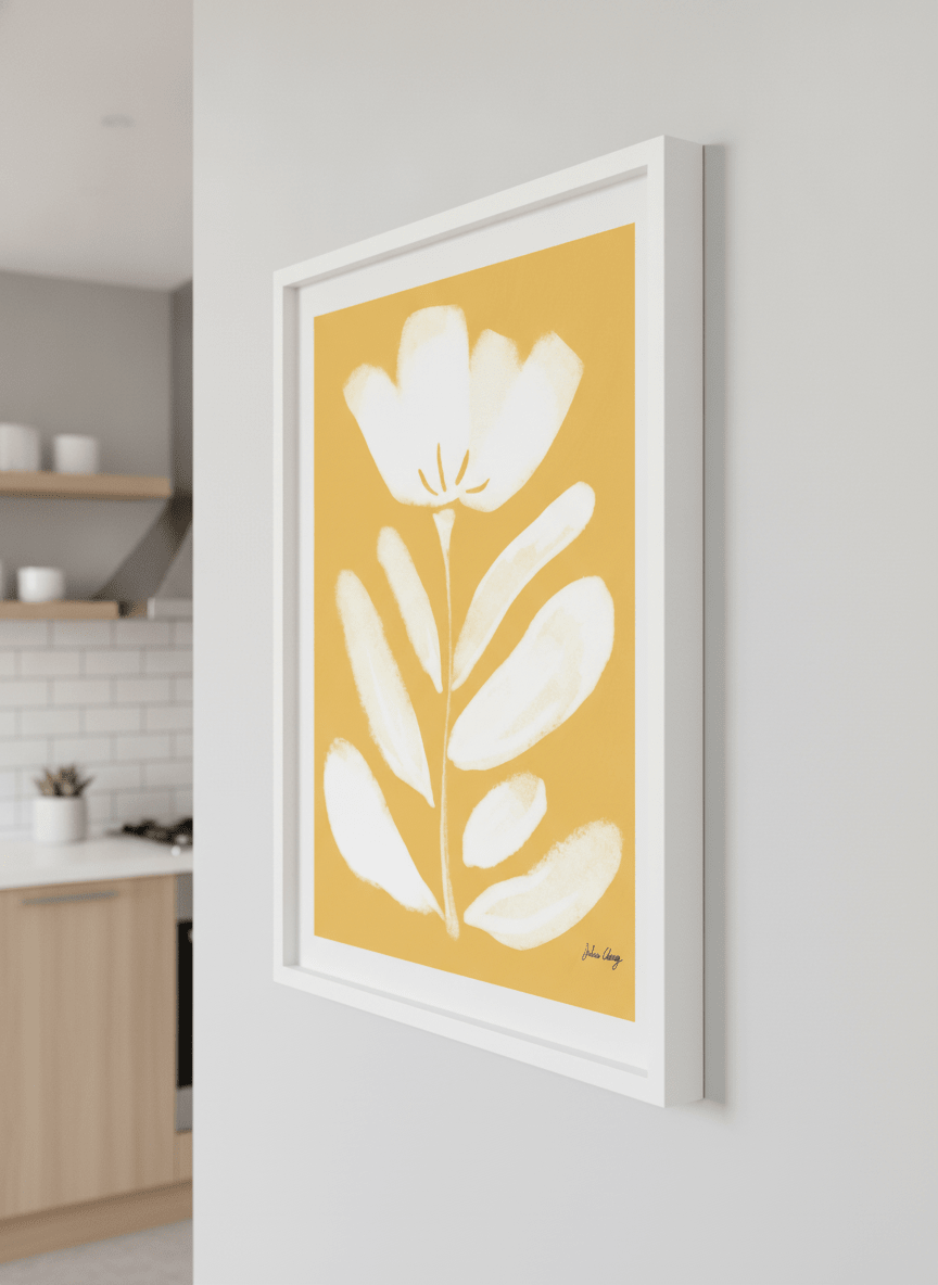 Artwork styled on the wall of a bright modern kitchen