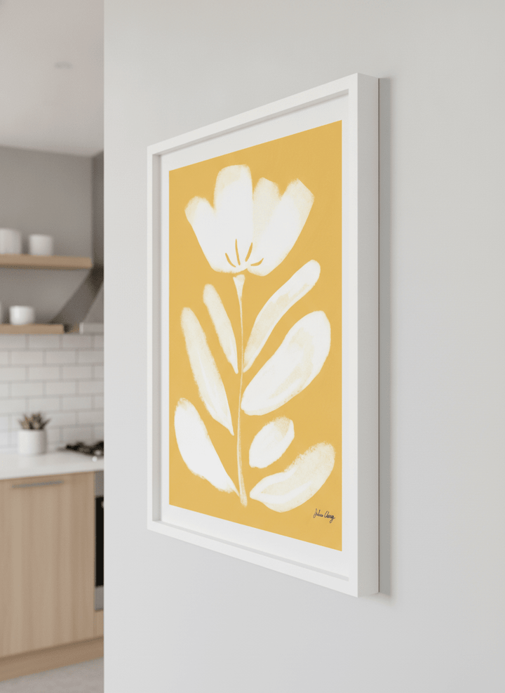 Artwork styled on the wall of a bright modern kitchen