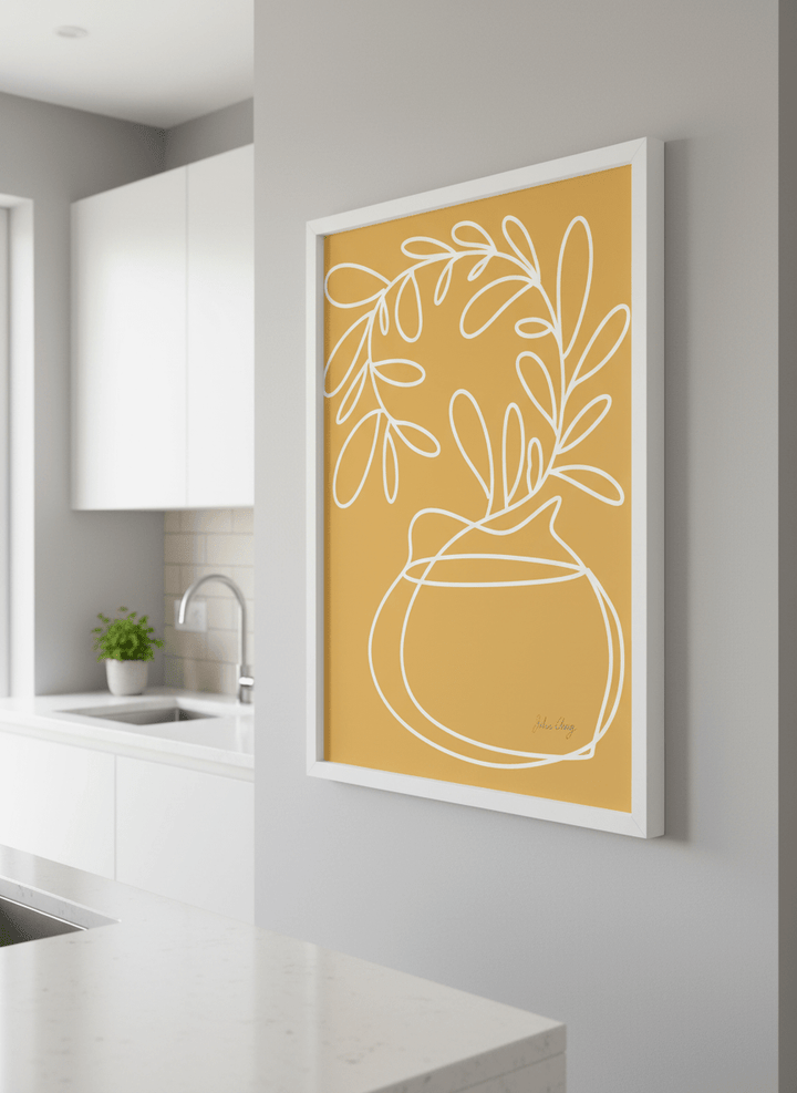 Artwork styled on the wall of a bright modern kitchen