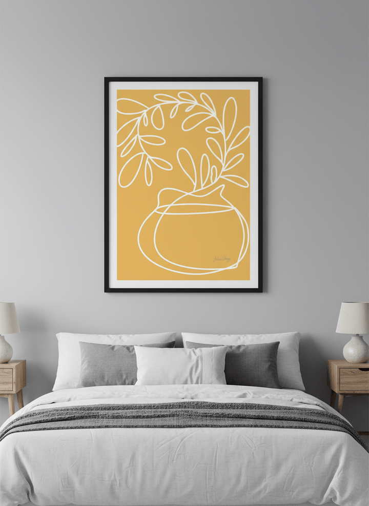 Minimalist artwork displayed in a calm, light-filled bedroom interior