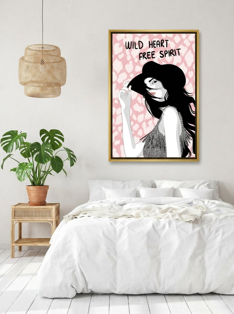 Canvas wall art with a gold leaf surround styled on the wall in a bright Scandinavian bedroom