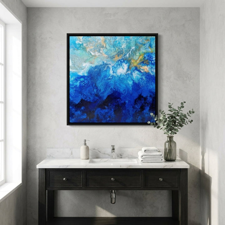 Canvas wall art with a black surround styled in a clean minimalist bathroom