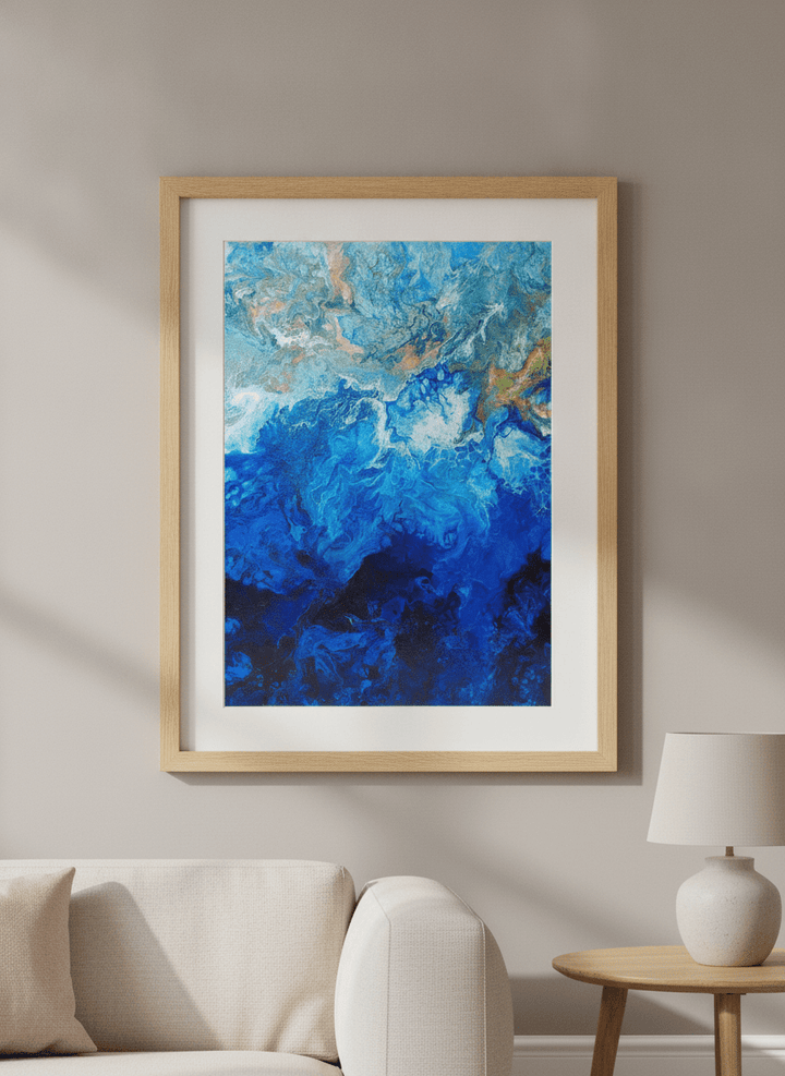Modern wall art styled above a sofa in a neutral living room