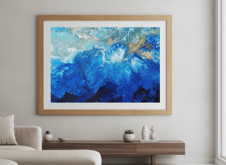 Modern wall art styled above a sofa in a neutral living room