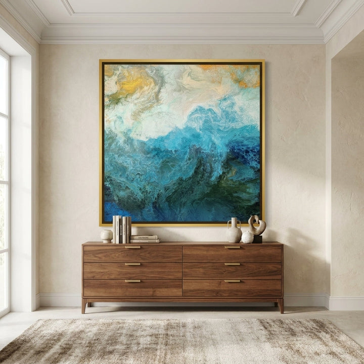 Oversized statement canvas wall art with a gold leaf surround styled in a luxe interior