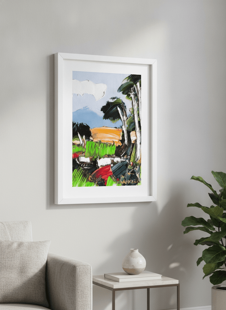 Modern wall art styled above a sofa in a neutral living room