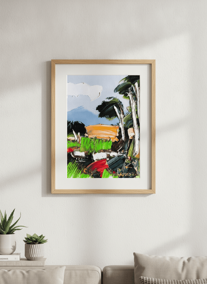 Modern wall art styled above a sofa in a neutral living room