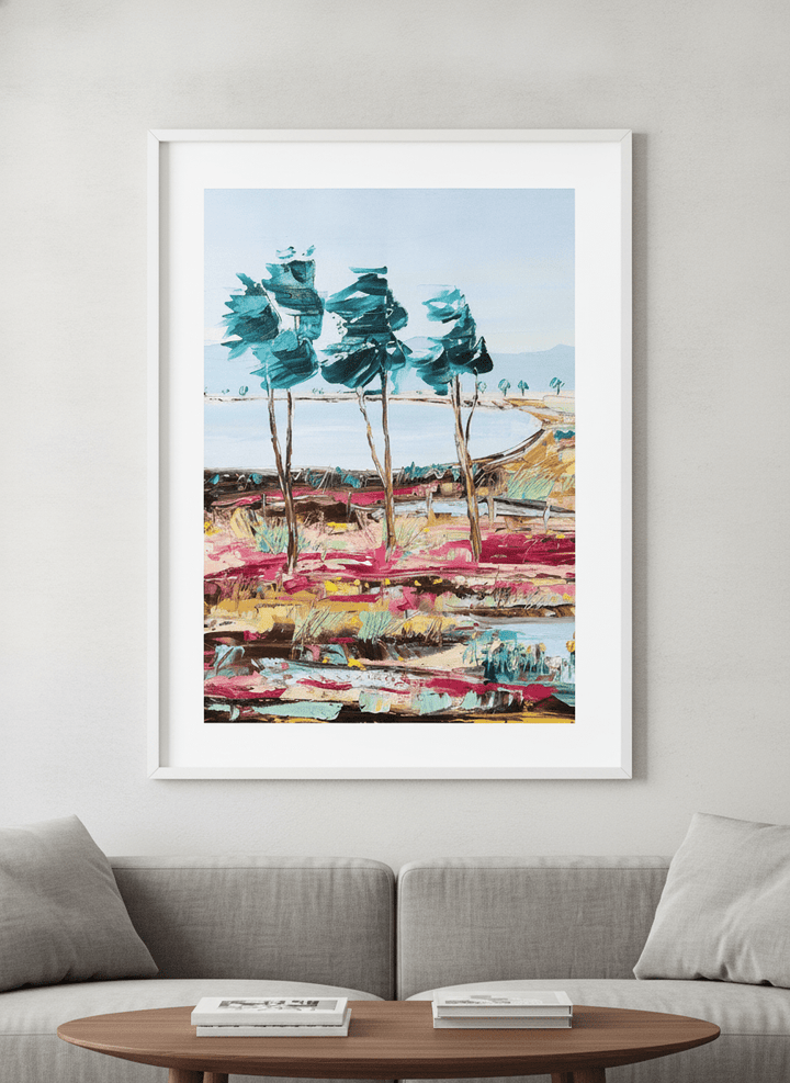 Modern wall art styled above a sofa in a neutral living room