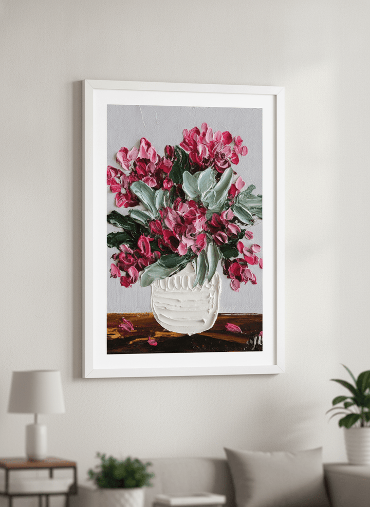 Modern wall art styled above a sofa in a neutral living room