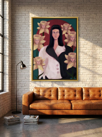 Oversized statement canvas wall art with a gold leaf surround styled on the wall in an industrial loft living room