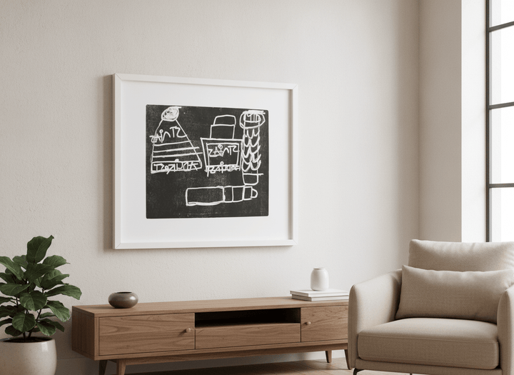 Modern wall art styled above a sofa in a neutral living room
