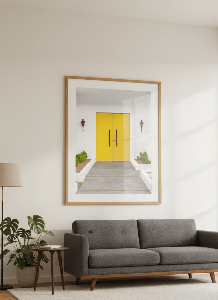 Modern wall art styled above a sofa in a neutral living room