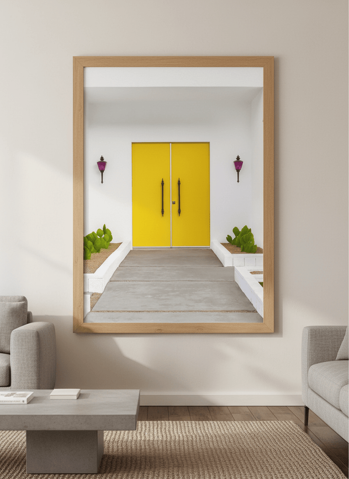Modern wall art styled above a sofa in a neutral living room