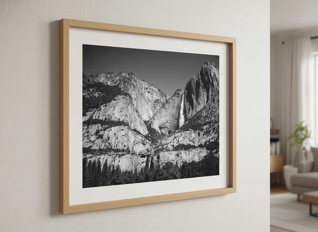 Modern wall art styled above a sofa in a neutral living room