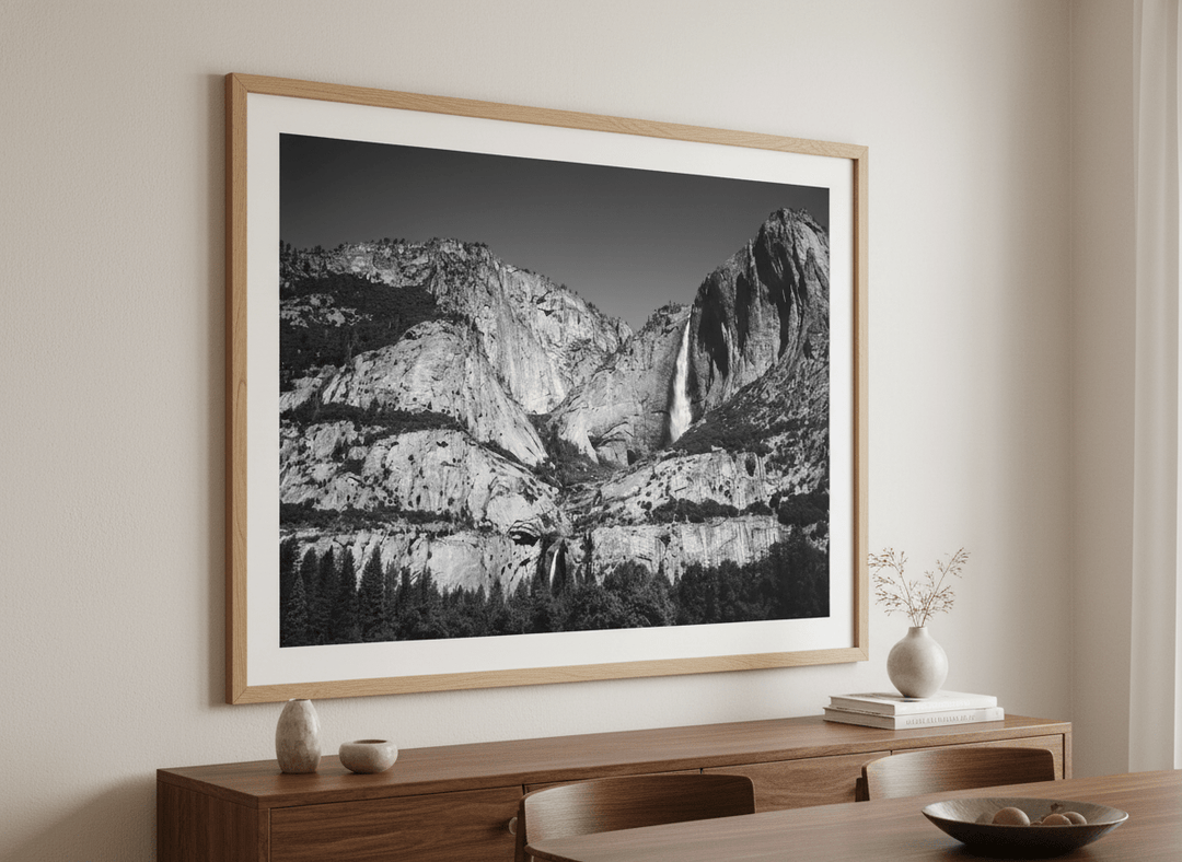 Wall art styled above a dining table in a contemporary home