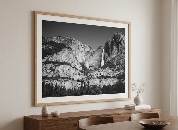 Wall art styled above a dining table in a contemporary home