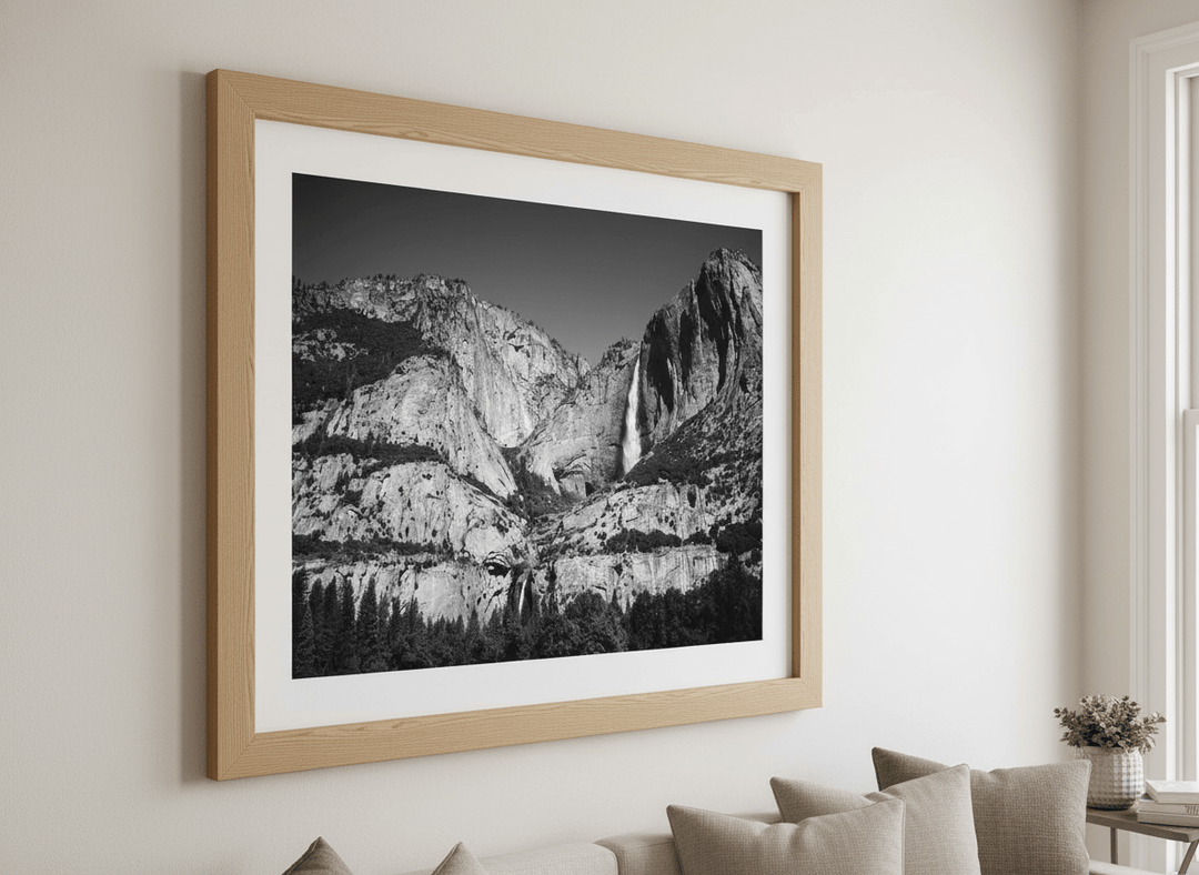 Modern wall art styled above a sofa in a neutral living room