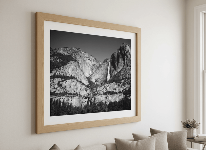 Modern wall art styled above a sofa in a neutral living room