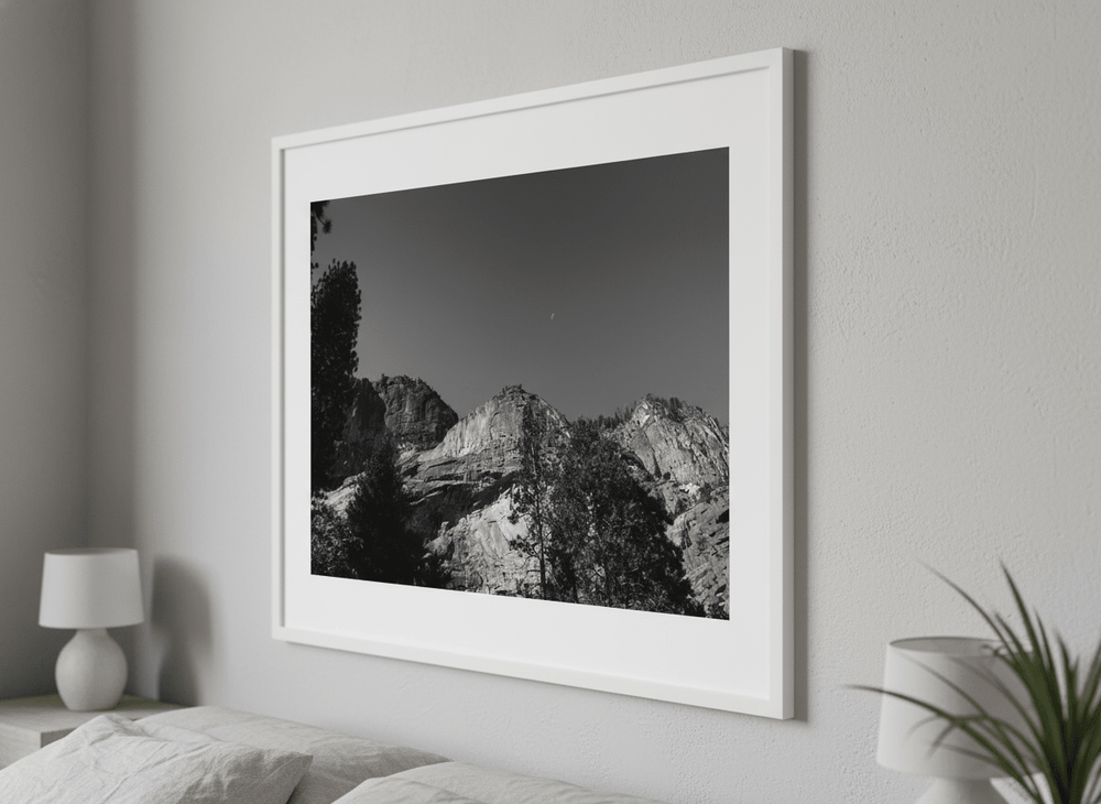 Minimalist artwork displayed in a calm, light-filled bedroom interior