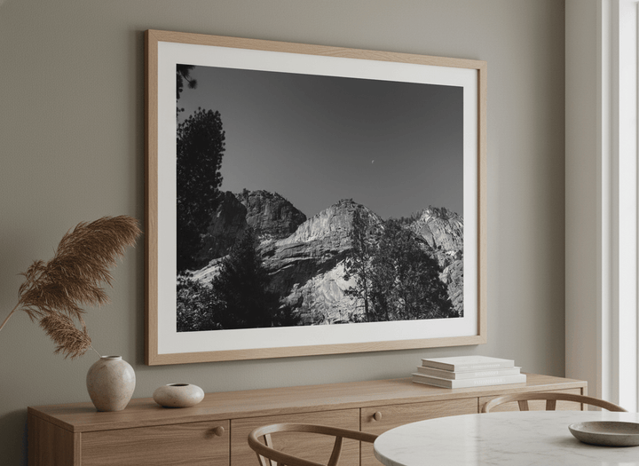 Wall art styled above a dining table in a contemporary home