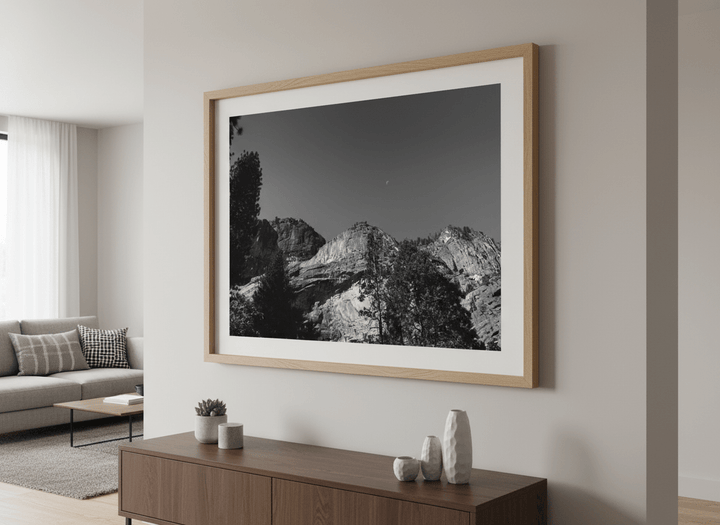 Modern wall art styled above a sofa in a neutral living room