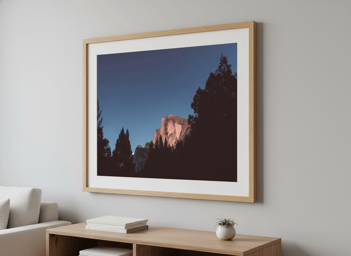 Modern wall art styled above a sofa in a neutral living room