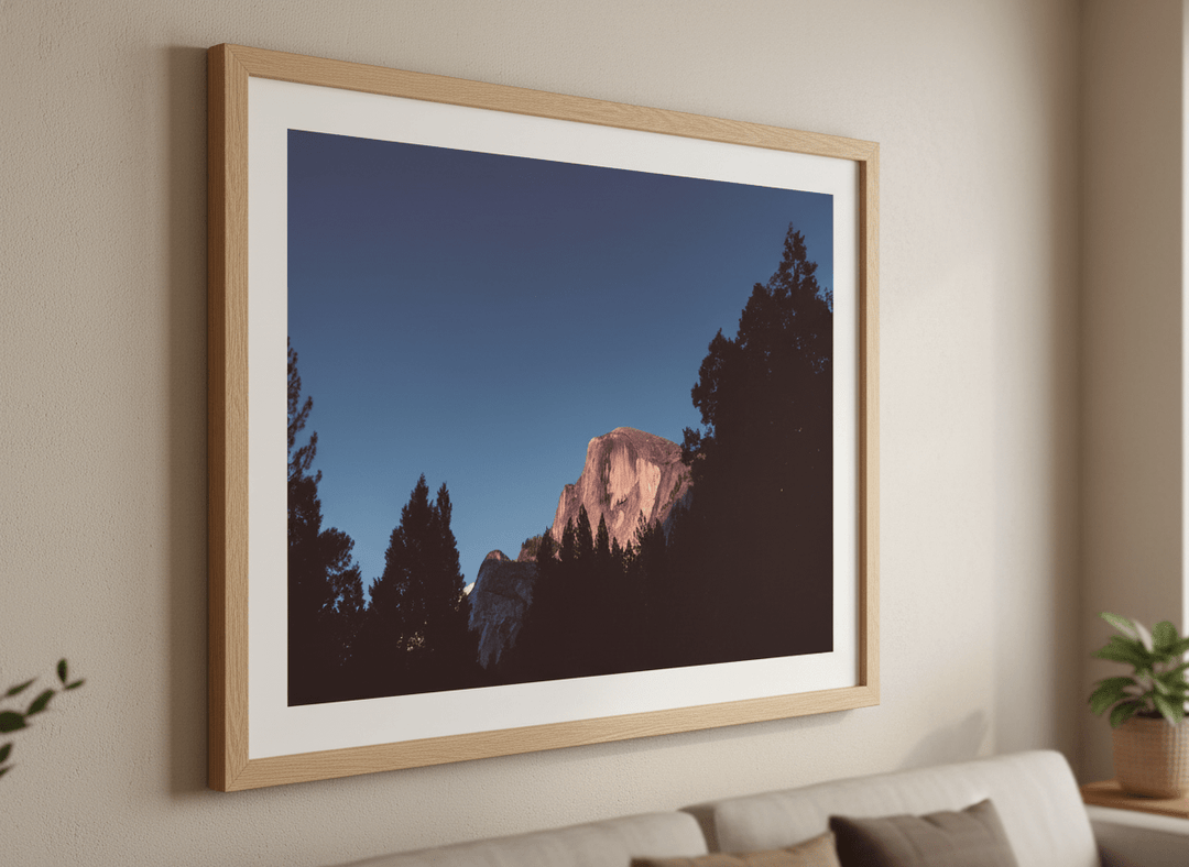 Modern wall art styled above a sofa in a neutral living room