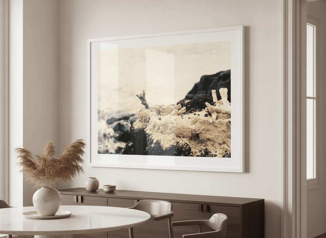 Wall art styled above a dining table in a contemporary home
