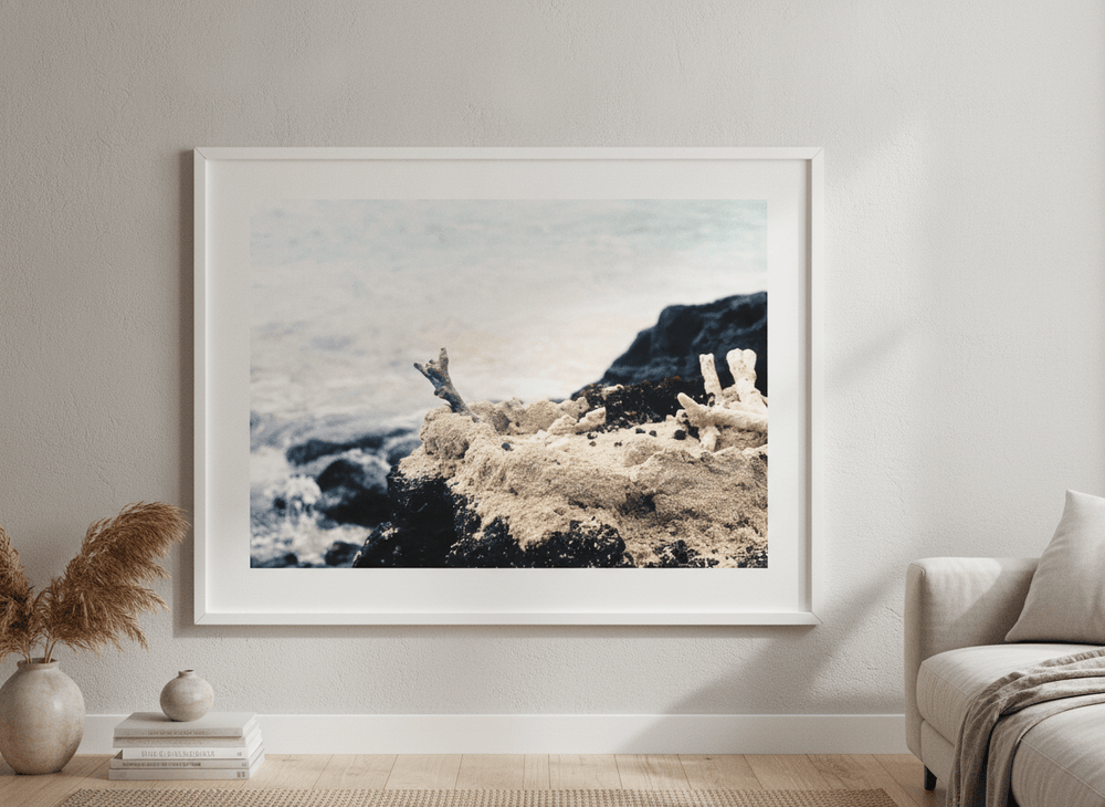 Modern wall art styled above a sofa in a neutral living room